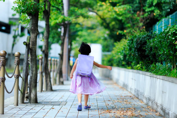 istock Girls carrying a school bag 865170234