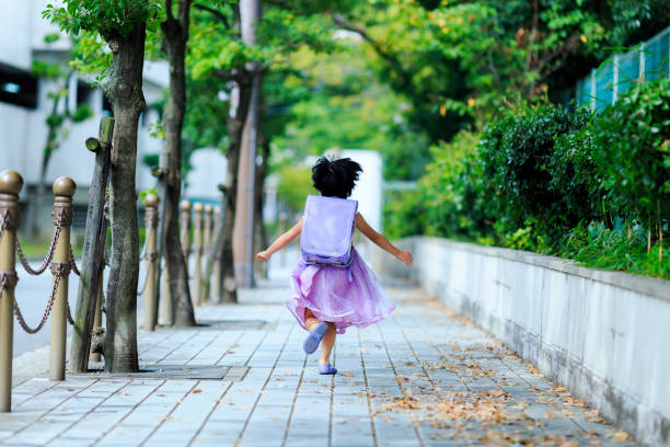 istock Girls carrying a school bag 865170290