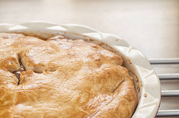 istock Freshly baked homemade apple pie on a wooden table 865170346