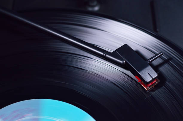 istock vinyl disc spinning on turntable with needle close up 865170618