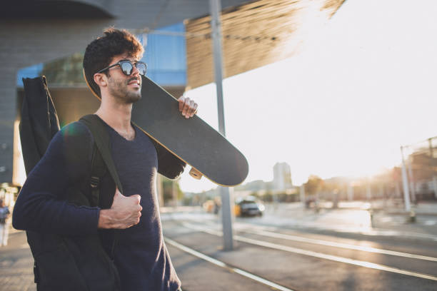 istock Hipster man with guitar and skateboard 865176994