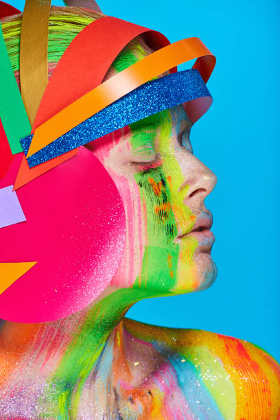 istock Model with colorful abstract makeup in multicolored helmet 865193668