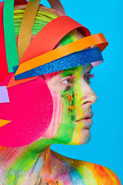 istock Model with colorful abstract makeup in multicolored helmet 865193748