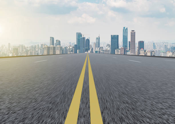 istock Road and city skyline 865193896