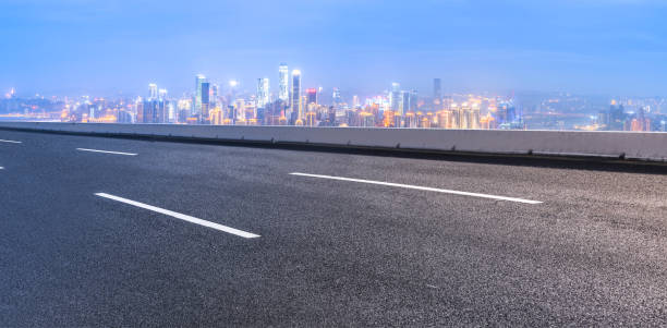istock Road and city skyline 865196100