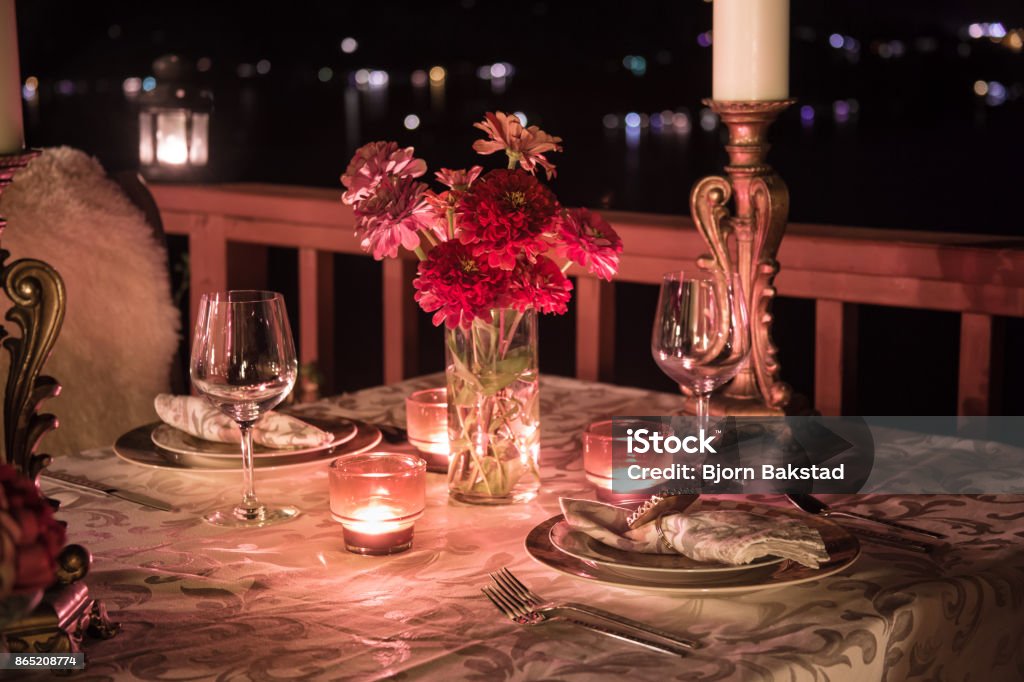 Romantic Dining at Night Candlelit Table Setting for Two with a View. Table For Two Stock Photo