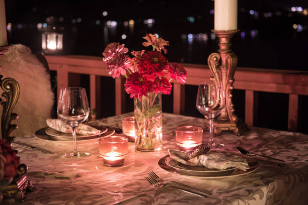 romantic dining at night - restaurant wine table table for two imagens e fotografias de stock