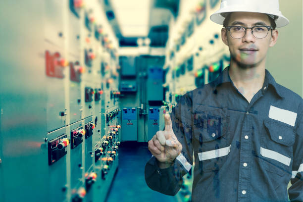 istock Double exposure of  Engineer or Technician man press his finger action in switch gear electrical room of oil and gas platform or plant industrial for monitor process, business and industry concept. 865223834