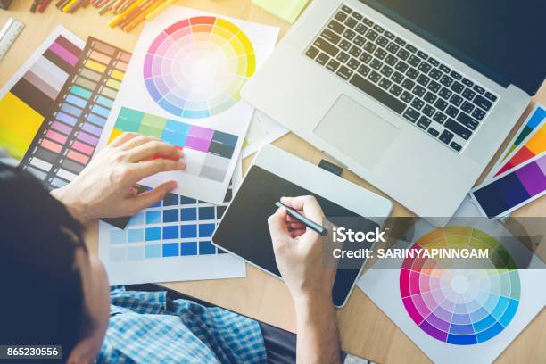 Graphic Designer Drawing On Graphics Tablet At Workplace Stock Photo - Download Image Now