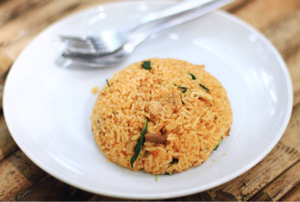 istock Curry fried rice with pork and mushroom on white plate 865242668