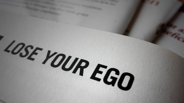 istock Lose your ego word on a book. 865244990