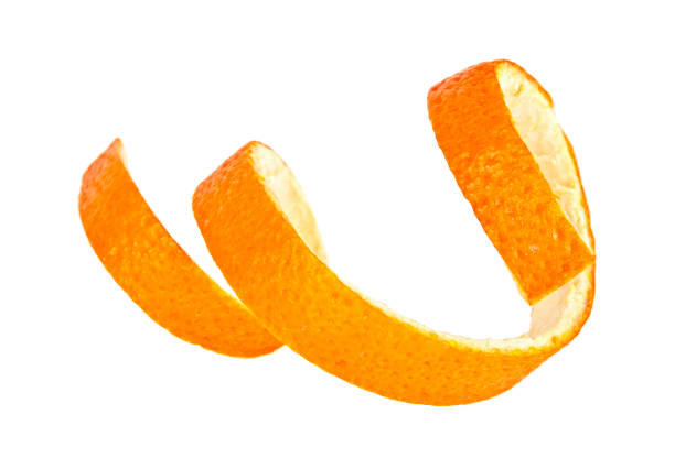 single orange peel on a white background - one slice imagens e fotografias de stock