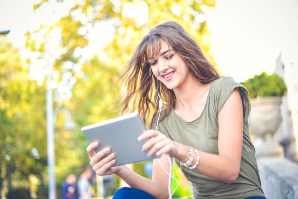 istock Young female  student learning in the city,autumn time. 865253954