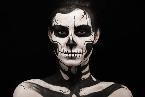 istock Pretty woman with skeleton tattoo 865256562