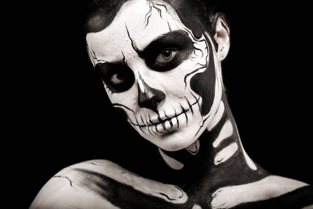istock Pretty woman with skeleton tattoo 865256596