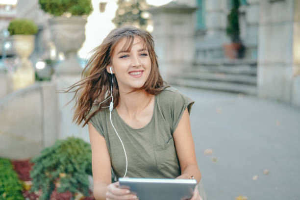 istock Young female  student learning in the city,autumn time. 865256660