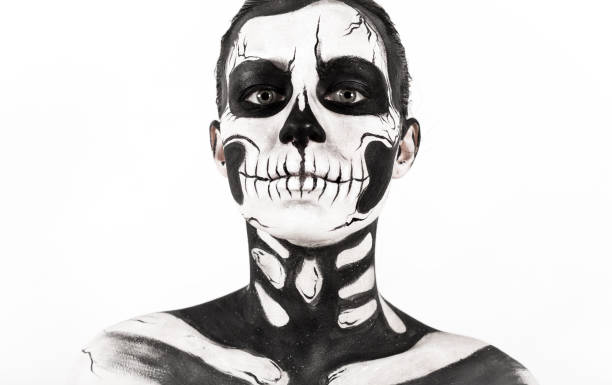 istock Attractive girl with skeleton makeup 865256950