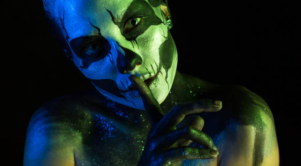 istock Attractive spooky girl with skeleton makeup 865257780