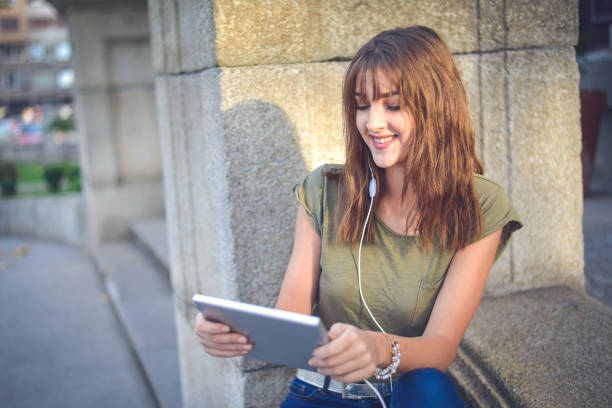 istock Young female  student learning in the city,autumn time. 865259428