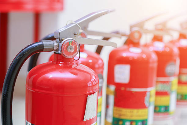 fire extinguishers available in fire emergencies. fire extinguishers available in fire emergencies. fire extinguisher photos stock pictures, royalty-free photos & images