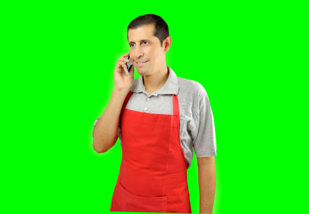 istock shopman uses a phone 865260534