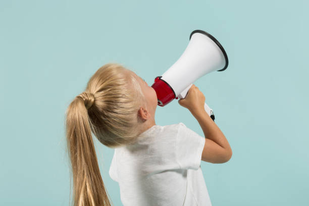 istock Attractive cute girl in light clothes hold megaphone 865264462