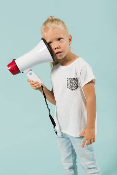 istock Attractive cute girl in light clothes hold megaphone 865264630
