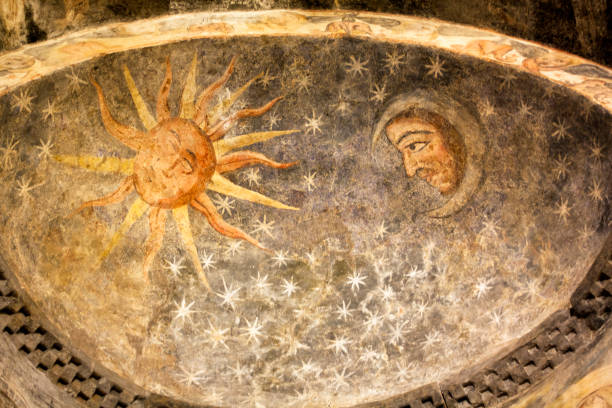San Martiño de Mondoñedo romanesque church, multi colored fresco, inner sky dome. San Martiño de Mondoñedo romanesque church, the oldest cathedral in Galicia, XI century, polychromatic fresco peeling off in inner dome, sun, moon and stars, sky dome . Foz, Lugo province, Galicia, Spain. medieval fresco stock pictures, royalty-free photos & images