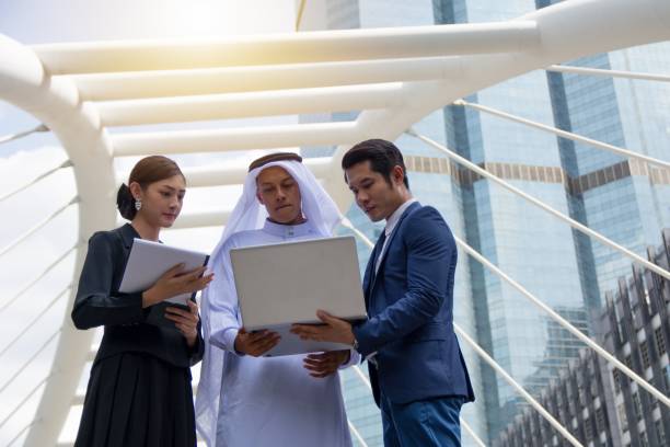 istock Young entrepreneurs reviewing and discussing business potentials 865272632