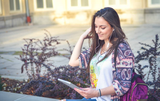istock Young female  student learning in the city,autumn time. 865272692