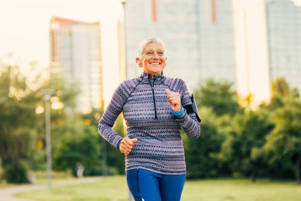 istock Senior woman jogging in the park 865272730