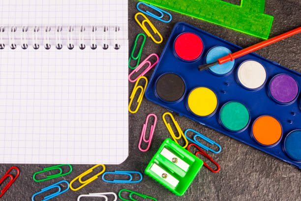 istock School supplies on black background ready for your design. 865276026