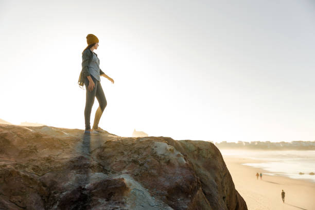 istock Woman over the cliff 865279864