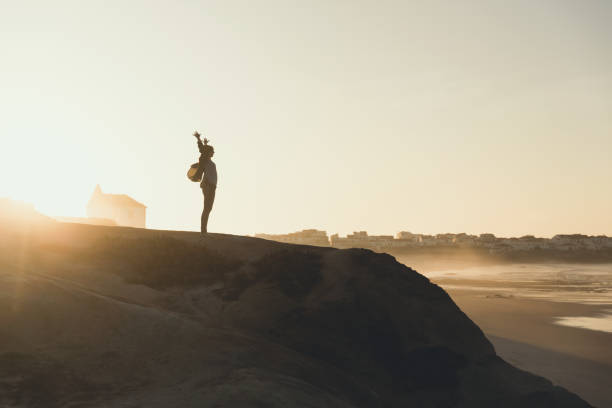 istock Woman over the cliff 865279976