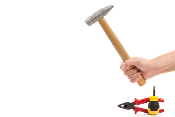 istock Hammer and pliers in the hands 865290602