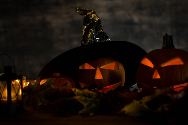 istock Halloween design with pumpkins. golden bokeh 865309242