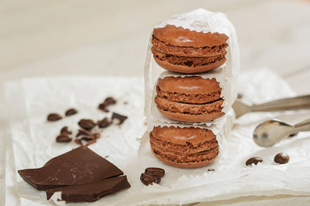 istock Chocolate with loose coffee beans and coffee flavored macaroons 865314382
