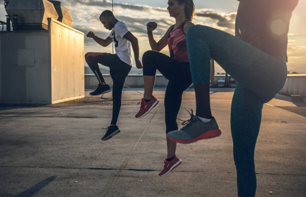 istock Three People Exercising Outdoors 865320316
