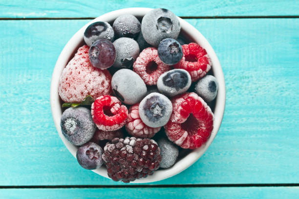 istock Frozen berries in a bowl. Mix berries 865323432
