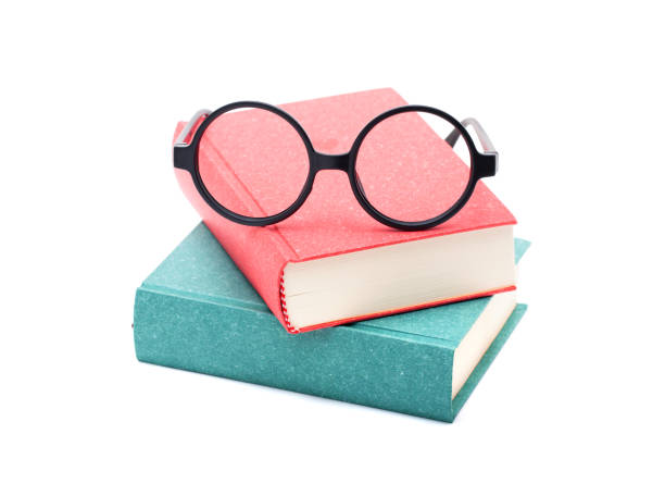 istock Books and glasses isolated on white background 865327484