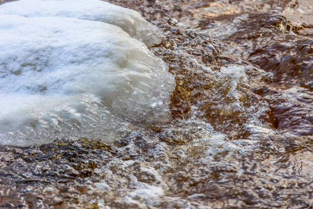 istock Ice floes with icicles on the river 865328040