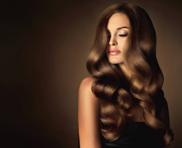 istock Young, brown haired beautiful model with long, wavy,well groomed hair. 865331900