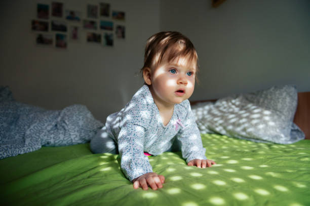 istock Baby girl has her first tooth 865338512