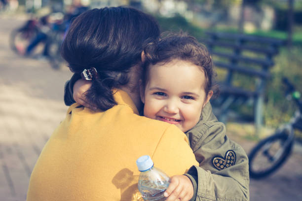 istock Happy daughter embracing her mother. 865339942