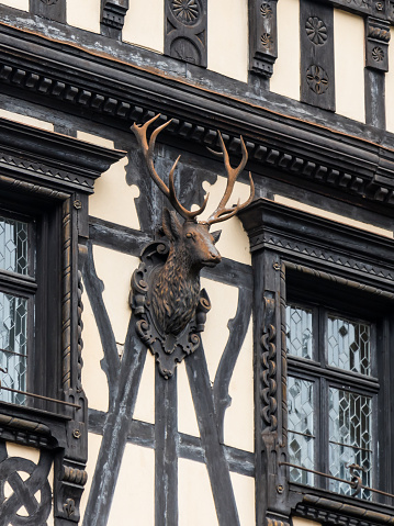 Sinaia, Romania, October 05, 2017 : The head of a deer on the wall of the house located near Pelesh castle in Sinaia, in Romania