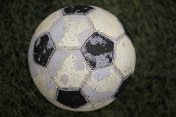 istock old soccer ball on a field with artificial turf 865352314