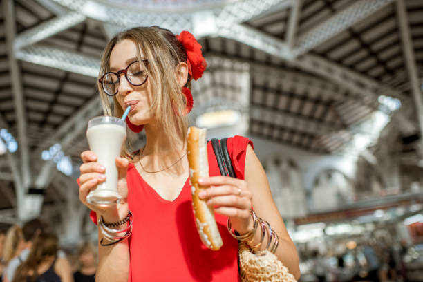 istock Woman with Horchata traditional spanish drink 865359596