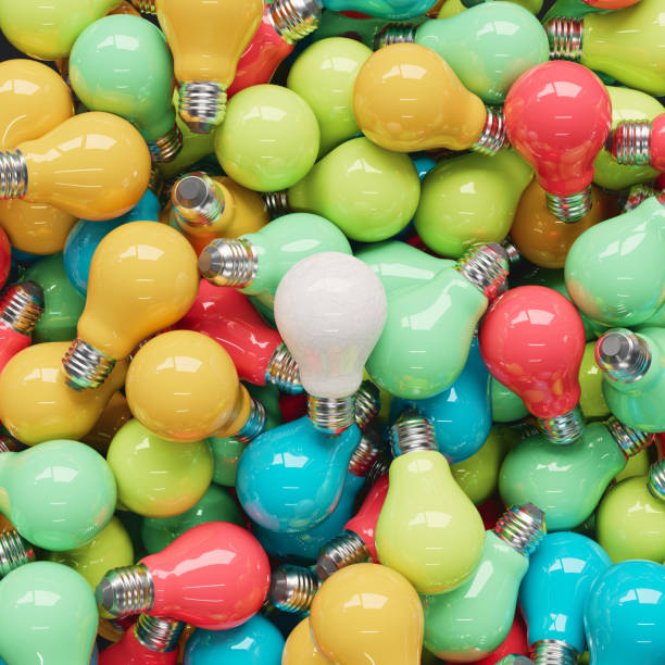 istock Scratched white light bulb on a pile of perfect brightly colored light bulbs 865359710