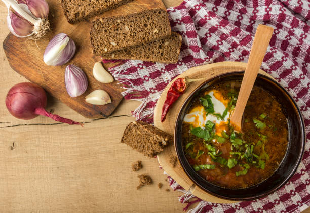 istock Borsch-soup with sour cream and bread. Top view 865360648