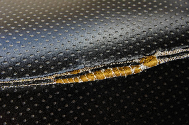 Close-up of luxury golden seat belt in first class. Safety belt on the plane, vehicle safety and protection of passengers.